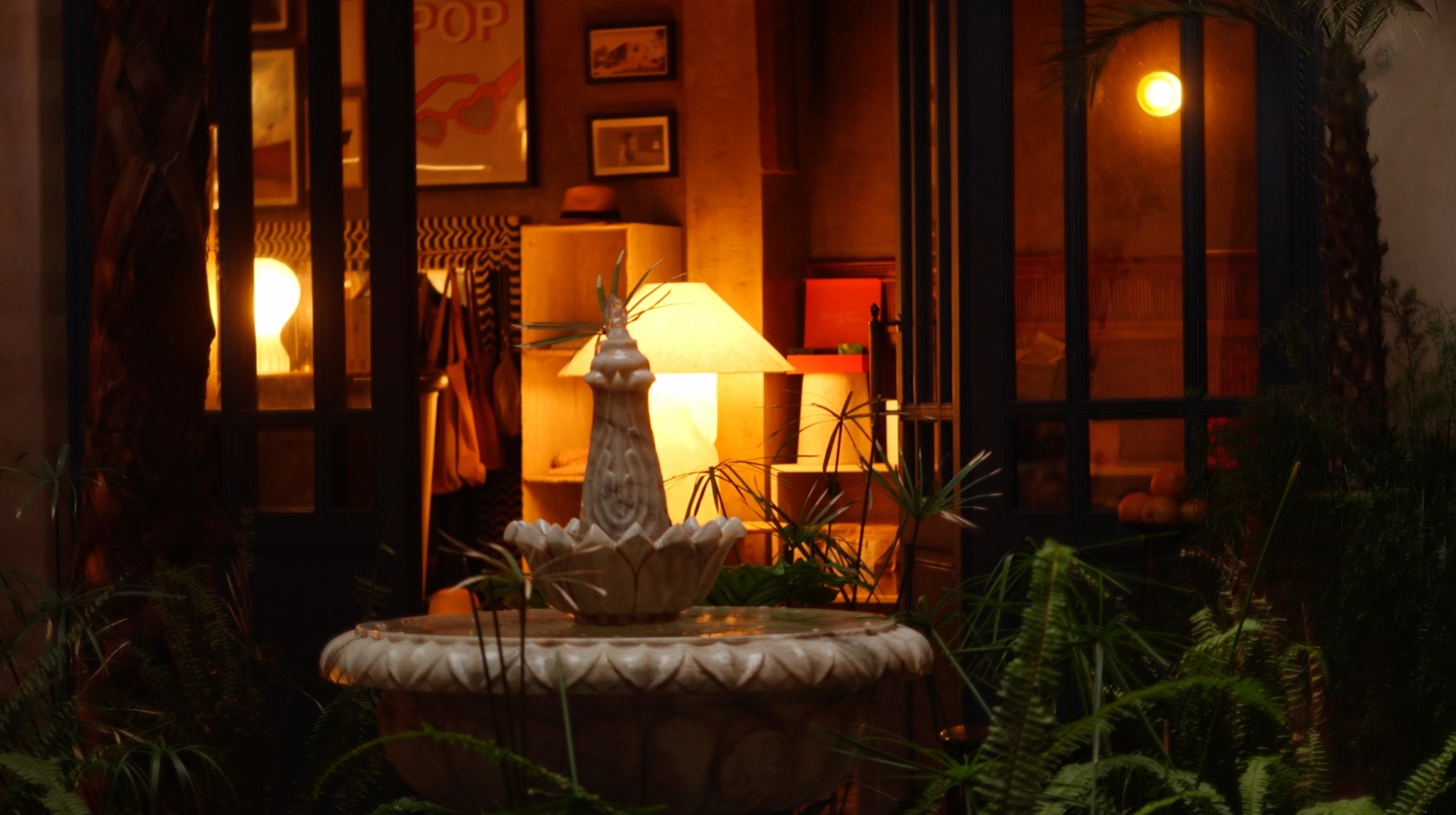 Riad El Aaiún — the fountain patio glowing at dusk